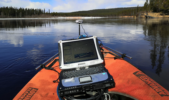 Research laptop on a floating measuring station in a river environment