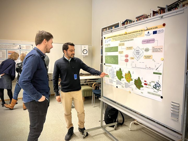 Researcher Joy Bhattacharjee from University of Oulu presenting his work to Jari-Pekka Nousu from LUKE