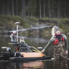 Researcher Linnea Blåfield with the Otter USV, photo Ville Kankare